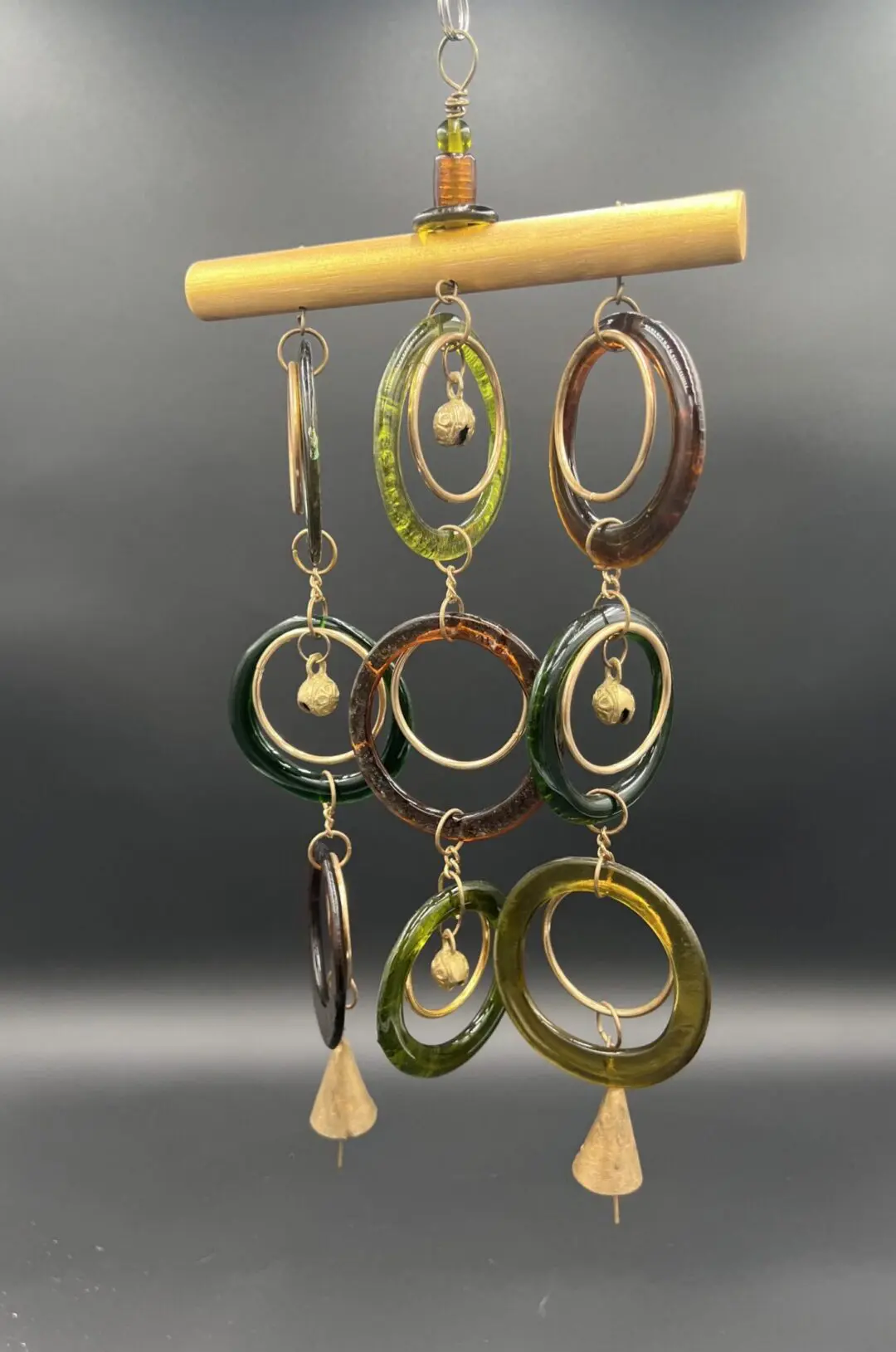 Colorful wind chime with hanging rings.
